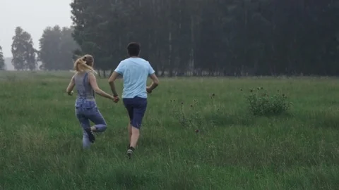 Beautiful young fun in a forest glade with his dog Stock Footage 70200977