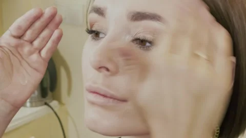 Beautiful young girl doing makeup in a beauty salon Stock Footage 337742017