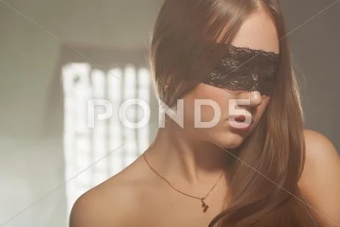 Beautiful young girl in the mask Stock Photos