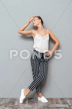 Beautiful young girl posing and looking away isolated Stock Photos