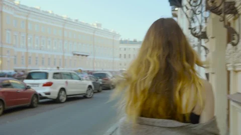 Beautiful young girl posing on city street Stock Footage 87584571