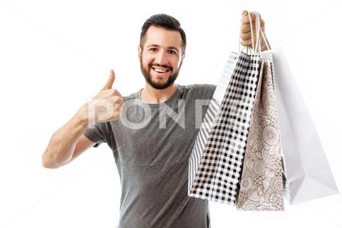 Beautiful young hipster, Shopaholic with bags shows class. isolated on white Stock Photos