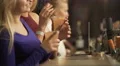 Beautiful young ladies partying, enjoying alcoholic cocktails near bar counter 4k or 4k+ Resolution