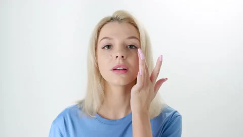 Beautiful young lady applying moisturizing creme, skin care concept Stock Footage 145932838