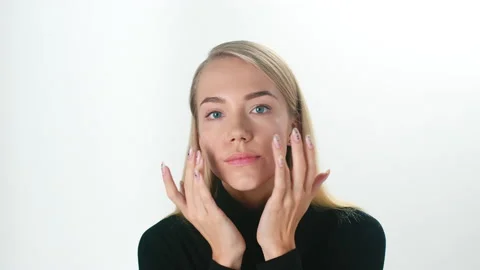 Beautiful young lady applying moisturizing creme, skin care concept Stock Footage 145933291