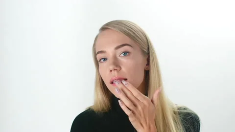 Beautiful young lady applying moisturizing creme, skin care concept Stock Footage 145933333
