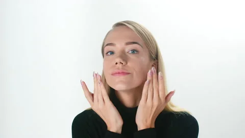 Beautiful young lady applying moisturizing creme, skin care concept Stock Footage 145933386