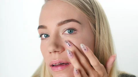 Beautiful young lady applying moisturizing creme, skin care concept. Stock Footage 146088141