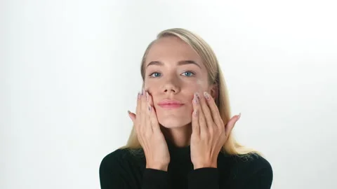 Beautiful young lady applying moisturizing creme, skin care concept. Stock Footage 146089016