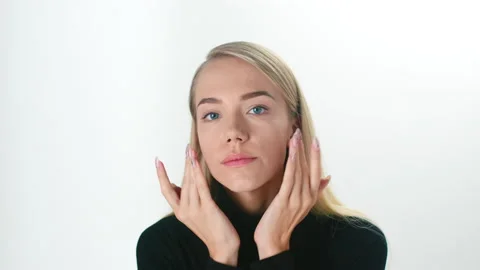 Beautiful young lady applying moisturizing creme, skin care concept. Stock Footage 146089296