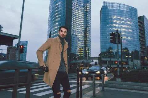 Beautiful young man posing at dusk Stock Photos