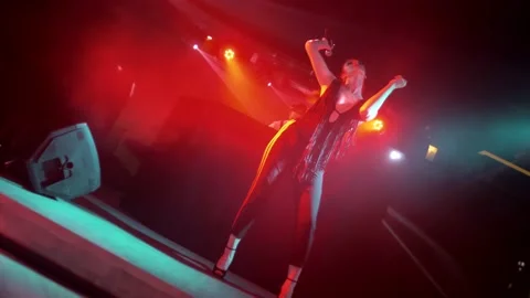Beautiful young singer dancing and performing on stage. Stock Footage 130186035