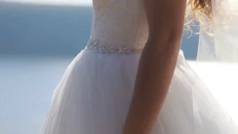 Beautiful young smiling bride posing on camera outdoors in a countryside Stock Footage 69148126
