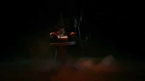 Beautiful young witch doing magic Stock Footage 64755941