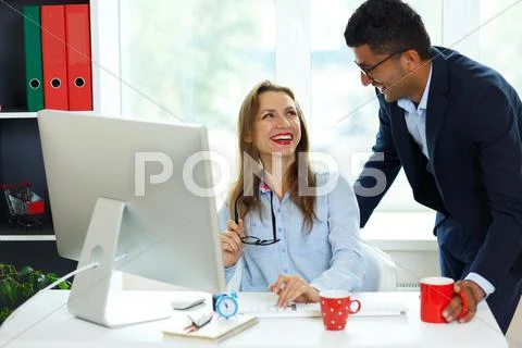 Beautiful young woman and man working from home Stock Photos