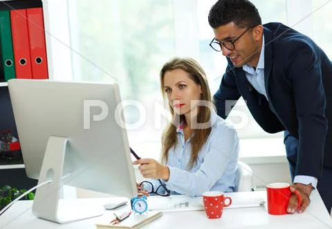 Beautiful young woman and man working from home Stock Photos
