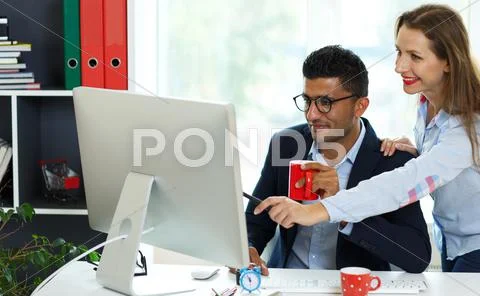 Beautiful young woman and man working from home Stock Photos