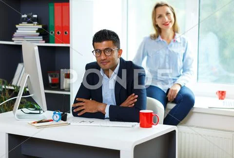 Beautiful young woman and man working from home Stock Photos