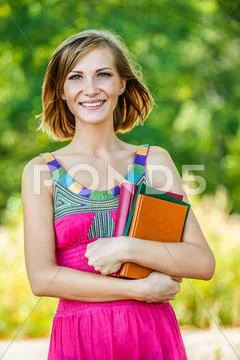 Beautiful young woman with books Stock Photos