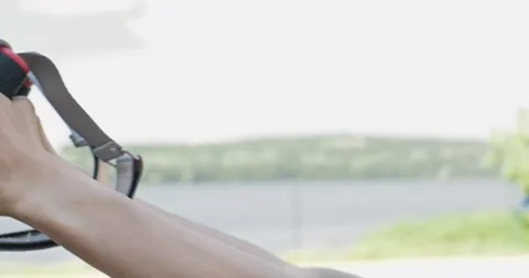 Beautiful young woman does training with fitness straps outdoor. Attractive Stock Footage 134131253