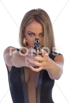 Beautiful young woman dressed in black with hand gun isolated on white Stock Photos