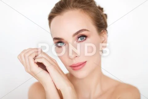 Beautiful young woman face and hands Stock Photos