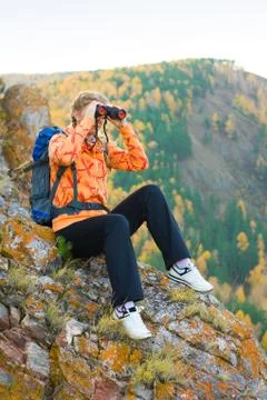 Beautiful young woman on mountain top Stock Photos