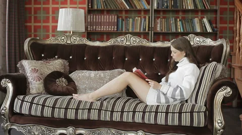 Beautiful young woman is resding at her luxurious home. Stock Footage