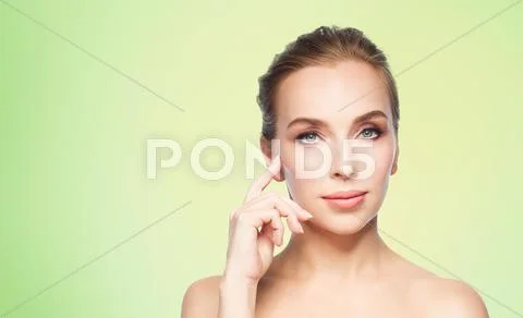 Beautiful young woman showing her cheekbone Stock Photos