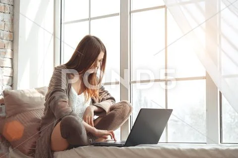 Beautiful Young Woman Sitting On A Windowsill Stock Photos