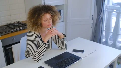 Beautiful young woman solving problem while working from home on lockdown in 4k  Stock Footage 168924671