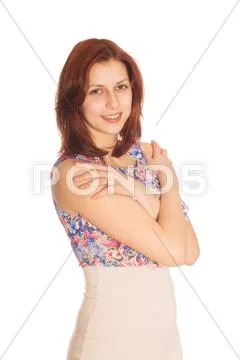 Beautiful young woman standing in her arms hugging the shoulders Stock Photos