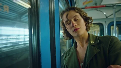 Beautiful young woman in train or subway car Stock Footage 157431153