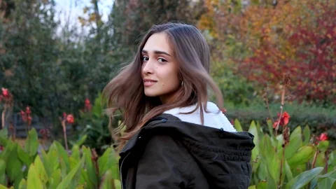 Beautiful young woman turn around in slow motion Stock Footage