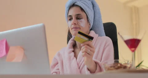 Beautiful young woman using computer and shopping online from the home. Stock Footage 148715858