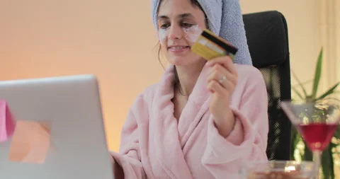 Beautiful young woman using computer and shopping online from the home. Stock Footage 148715996