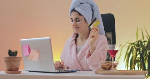 Beautiful young woman using computer and shopping online from the home. Stock Footage 148719770