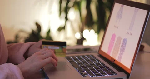Beautiful young woman using computer and shopping online from the home. Stock Footage 148826598
