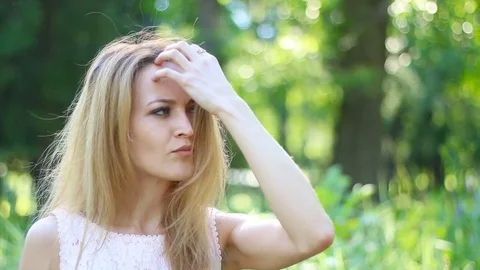 Beautiful young woman waiting for someone. impatient woman looking around her Stock Footage