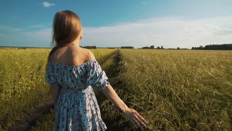 Beautiful Young Woman Walking By The Country Road Stock Footage