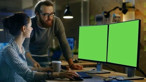 Beautiful Young Woman Works on a Isolated Mock-up Green Screen Personal Computer Stock Footage