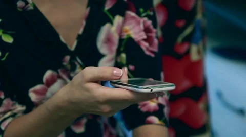 Beautiful young woman's hand using smart phone at beach,flare light Stock Footage 66427886