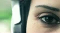beautifull woman look at camera while listens to music HD Footage