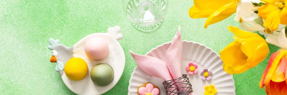 A beautifully arranged Easter table setting showcases a decorative egg nest.. Stock Photos