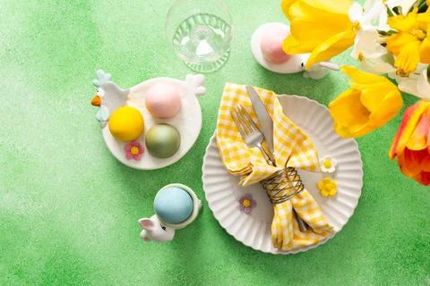 A beautifully arranged Easter table setting showcases a decorative egg nest.. Stock Photos