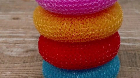 A Beautifully Colorful Stack of Mesh Loofah Sponges Perfect for Your Bathing Видео 290227059