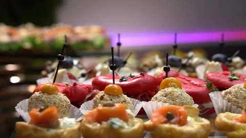 Beautifully decorated banquet table with appetizers from different types of fish 库存影片 300150853