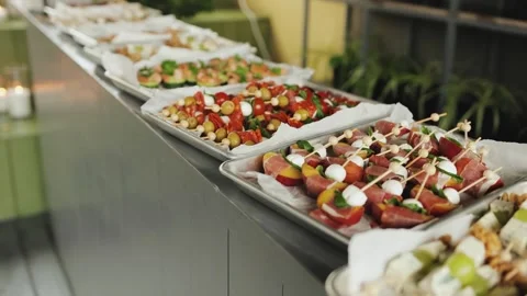 Beautifully decorated buffet table for catering. Trays with appetizers for spicy Stock Footage 318066411