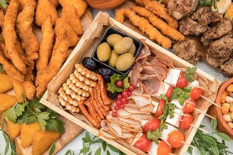 Beautifully decorated catering table with different food snacks. Stock Photos