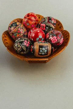 Beautifully decorated Easter eggs in handcrafted bowl Stock Photos